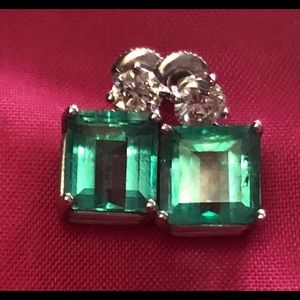 14K white gold emerald and diamond earrings.